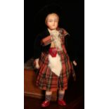 A bisque shoulder head costume doll, the bisque shoulder head with painted features including