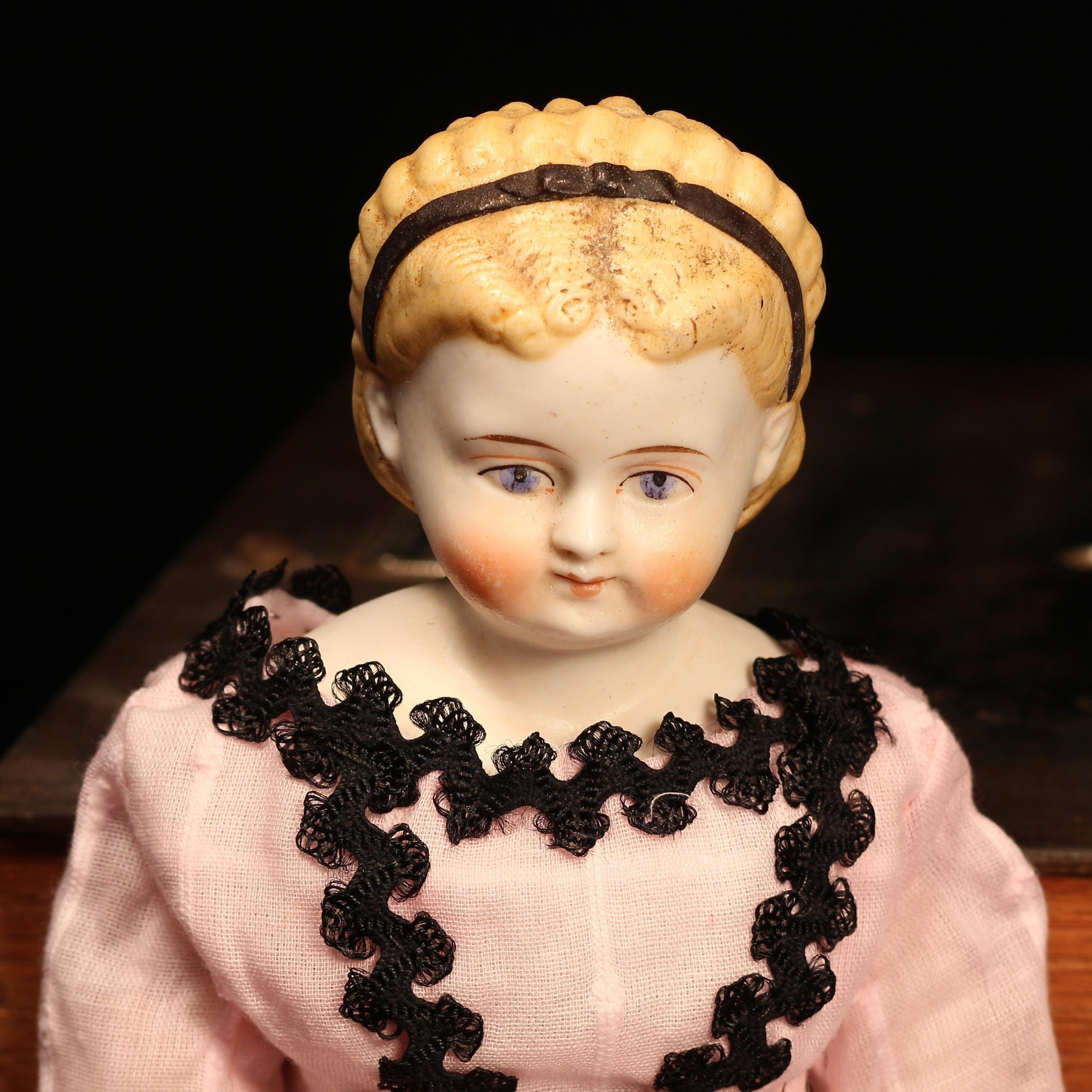 A 19th century unglazed Parian type shoulder head doll, the unglazed Parian type shoulder head - Image 2 of 2