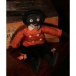 Folk Art - an early 20th century stuffed cloth black doll, the fabric head applied with black and