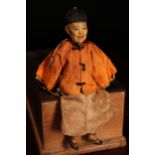 An early 20th century Chinese Door of Hope Mission 'Father' doll, the painted papier-mâché head with