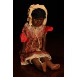 An early 20th century painted composition black shoulder head 'automaton' type doll, the painted