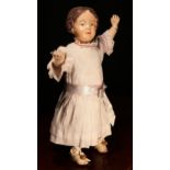An early 20th century Schoenhut carved and painted wooden character doll, the carved and painted