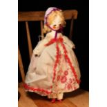 A reproduction 'Queen Anne' style carved and painted wooden artist doll, the carved and painted head