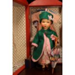 An early 20th century painted composition head and painted composition jointed bodied doll, the
