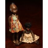 An early 20th century black composition jointed doll, painted features, black flock type hair, 9cm