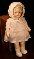 A 1930's/1940's cloth doll, attributed to Gerogene Averill (America), the cloth moulded face with