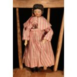 A 19th century 'Grödnertal' or 'Dutch' peg style doll, the carved and painted head with painted