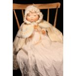 A 1920's Borgfeldt painted composition head 'Bye-Lo Baby' doll, designed by Grace Storey Putnam, the