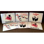 Breweriana - a set of six cork backed Guinness table mats comprising two “Lovely day for a