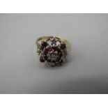 9ct gold floral cluster ring with red and white stones 3.22 gms size M