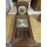 An oak wall clock and a brass faced battery mantel clock