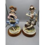 Galos Spanish figures of girl and boy on wooden plinths approx 30cmH c1960