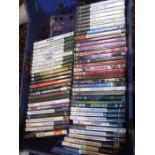 A crate of playstation, Xbox games and dvds