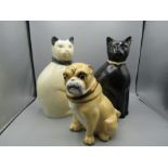 Two ceramic cats and one pug biscuit caddy