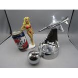 A Swiss Bohler aeroplane ashtray, A pin-up can holder and a table lighter