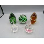 Five glass paper weights