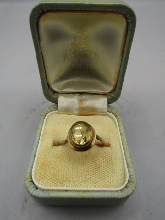 A gold ring stamped 9ct with yellow stone 2.24gms size k-l