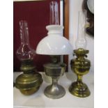 3 oil lamps 2 with brass bases and one with metal