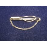 9ct gold tie clip with chain marked 375 on chain 4.45 gms
