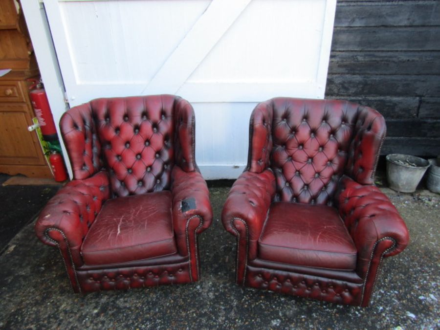 Pair of ox blood red leather button back wing armchairs (some damage to one chair as seen in - Image 2 of 6