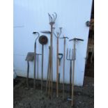 Mixed garden tools including shovel and fork