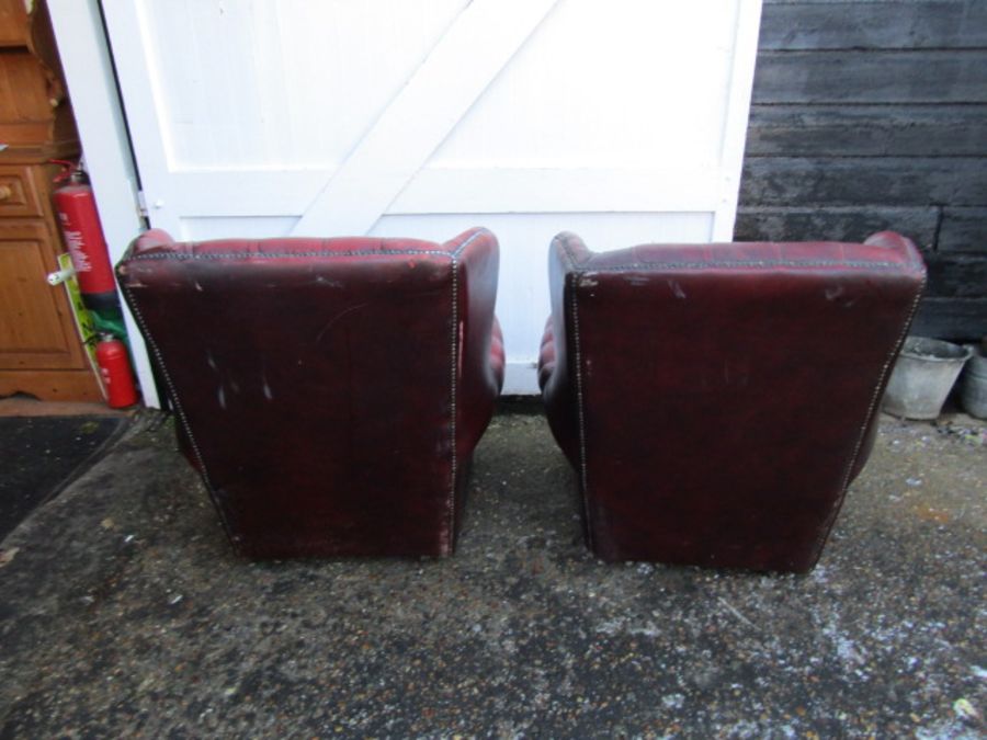 Pair of ox blood red leather button back wing armchairs (some damage to one chair as seen in - Image 6 of 6