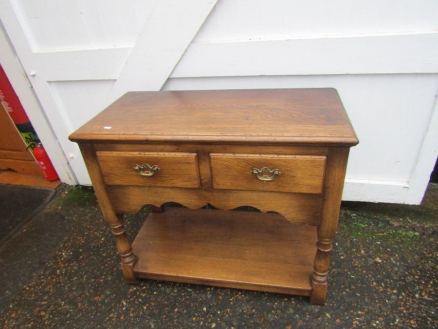 2 Drawer oak lowboy with brass handles H77cm W91cm D46cm approx