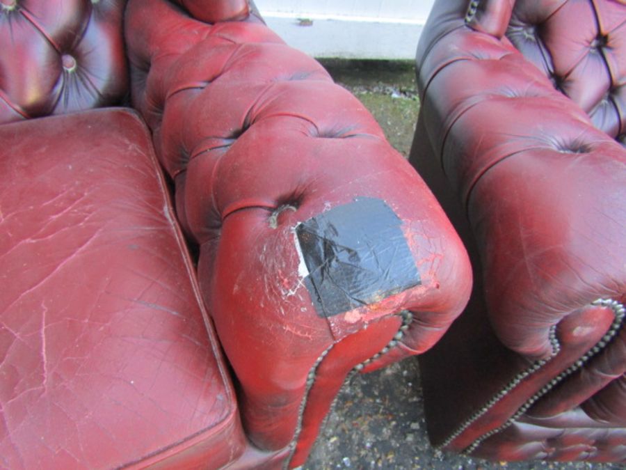 Pair of ox blood red leather button back wing armchairs (some damage to one chair as seen in - Image 3 of 6