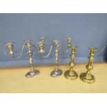 Pair of silver plated candelabras and brass candle sticks