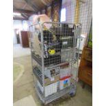 Stillage containing Mangar bathing cushion (PAT tested), books, mobile phones and lamps etc.