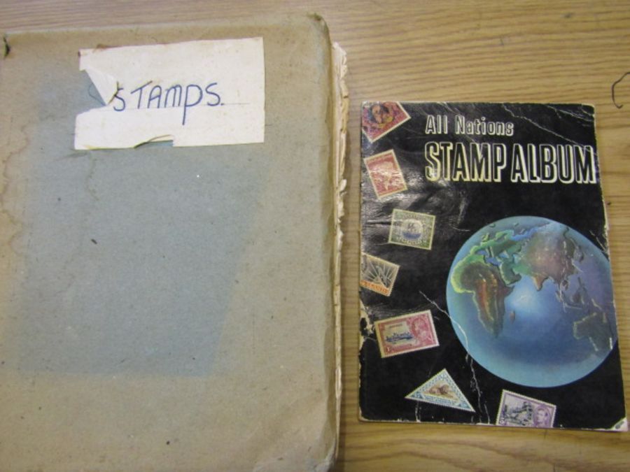 2 stamp albums, around the world, mixture of full and empty pages