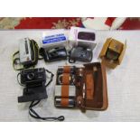 Cameras and male grooming kits