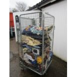 Stillage containing clothes, linen and a rug