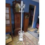 A coat and hat stand in white