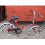 A retro Sovereign folding bike and a kids bike