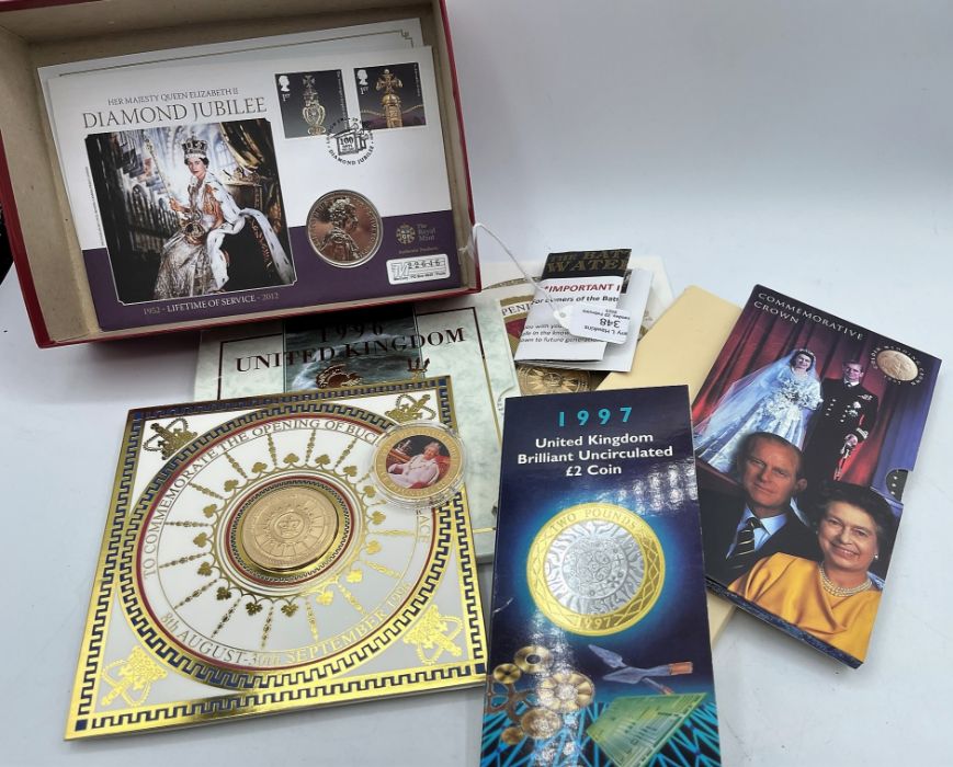 A box of coin collection to include: 1996 uncirculated coin collection; 3 medallions to