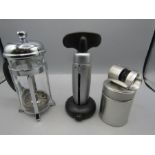 Dualit bottle opener/cutter, champagne bottle stopper in tin and a cafetiere