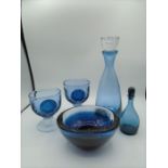 Wedgwood blue glass collection to include decanter, two goblets and a bowl, all engraved to base