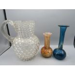 A pebbled water jug and 2 craft vases