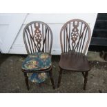 A pair wheelback chairs