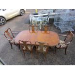 Burr Walnut veneered double pedestal extending dining table with 6 upholstered dining chairs