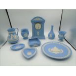 Wedgwood blue Jasperware collection to incl Millennium 2000 mantel clock, vases, trinket trays,