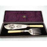 A boxed silver plated fish serving set