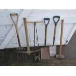 Garden tools to include pick axe, sledge hammer, post hole digger and shovels etc