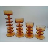 4 graduated Wedgwood Sheringham amber/topaz glass candle holders designed by Ronald Stennett