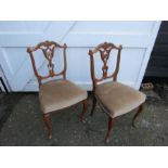 Pair of upholstered mahogany dining chairs
