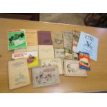Vintage car manuals and cigarette card albums