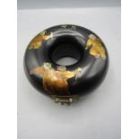 A Chinese lacquered circular jewellery box with brass escutcheon