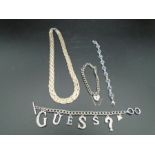A 925 marked platted necklace, a 925 heart lock bracelet, a 'T' bar 'Guess' bracelet and a