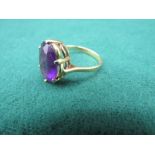 14c gold ring with a purple stone3.9 gms size 0